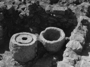 Olive press (left) and olive crushing basin (right)